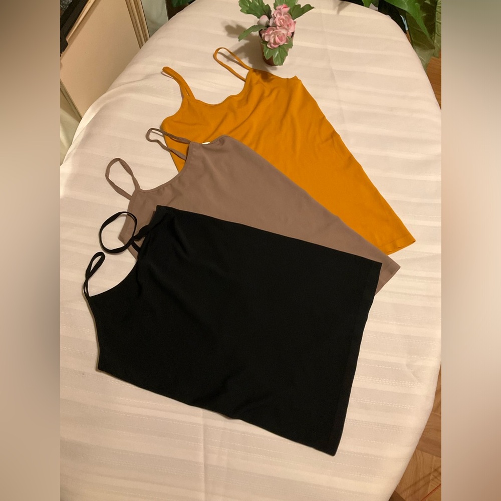 A Bundle of 3 Buzz one size tank Tops